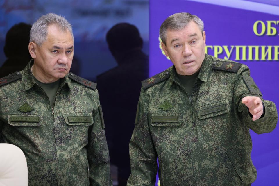 FILE - Russian Defense Minister Sergei Shoigu, left, and Chief of the Russian General Staff Valery Gerasimov attend the meeting with Russian President Vladimir Putin during his visit to the joint staff of troops involved in Russia's military operation in Ukraine, at an unknown location, Saturday, Dec. 17, 2022. One possible reason for Prigozhin's mutiny, he said, was the Defense Ministry's refusal to extend a multibillion-dollar contract with his legal catering company, Concord, to supply food to the army. (Gavriil Grigorov, Sputnik, Kremlin Pool Photo via AP, File)