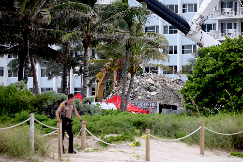 Image: A pile of debris from the collapsed 12-story Champlain Towers South condo building is seen from the beach on July 12, 2021 in Surfside, Fla. (Anna Moneymaker / Getty Images)