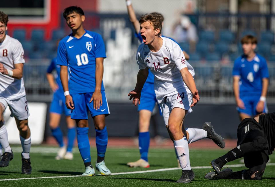 Brebeuf Jesuit Preparatory High School junior Ben Haneline (14) reacts after scoring during the second half of an IHSAA Class 2A boys’ soccer State Championship match against Mishawaka Marian High School, Saturday, Oct. 29, 2022, at IUPUI’s Michael A. Carroll Track and Soccer Stadium in Indianapolis.