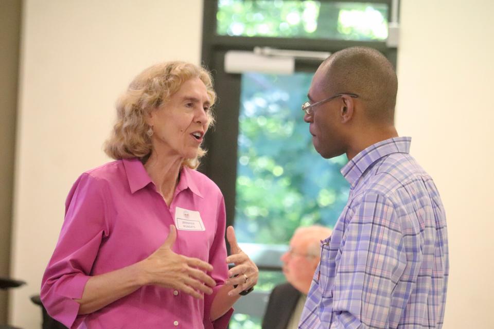 Jennifer Roberts, left, of The Carter Center and a former Charlotte mayor, talks with Brandon Robinson, president of the 16th Judicial District Bar and Durham County Bar Association, on Monday, July 15, 2024, at a meeting of the Commission on the Future of North Carolina Elections. The commission, a statewide, cross-partisan group sponsored by the nonprofit Carter Center, released this week a draft report on the fairness, safety and security of elections in North Carolina. The meeting was held at the Center for the Environment at Catawba College in Salisbury, NC.