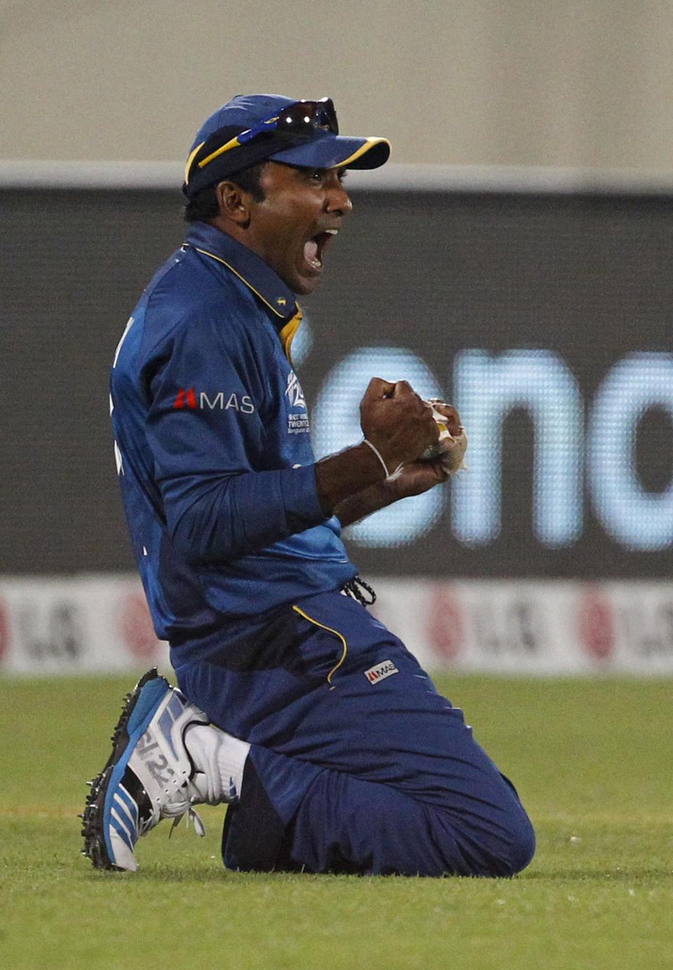 Sri Lanka's Mahela Jayawardena reacts after successfully taking a catch to dismiss West Indies's Dwayne Bravo during theirICC Twenty20 Cricket World Cup semi-final match in Dhaka, Bangladesh, Thursday, April 3, 2014. (AP Photo / A.M. Ahad)