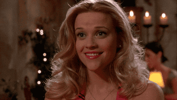 In 'Legally Blonde', Elle looks off-camera as the smile falls from her face