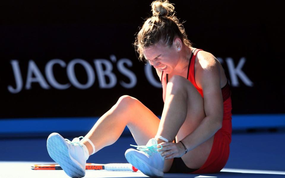 Simona Halep twisted her ankle during her first-round win - REUTERS