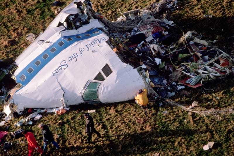 The cockpit section of ‘Clipper Maid of the Seas, Pan Ams flight 103 is inspected by police and specialists as it lay on the ground following a midair explosion over the village of Lockerbie, Dumfries and Galloway, United Kingdom, on Thursday, December 22, 1988