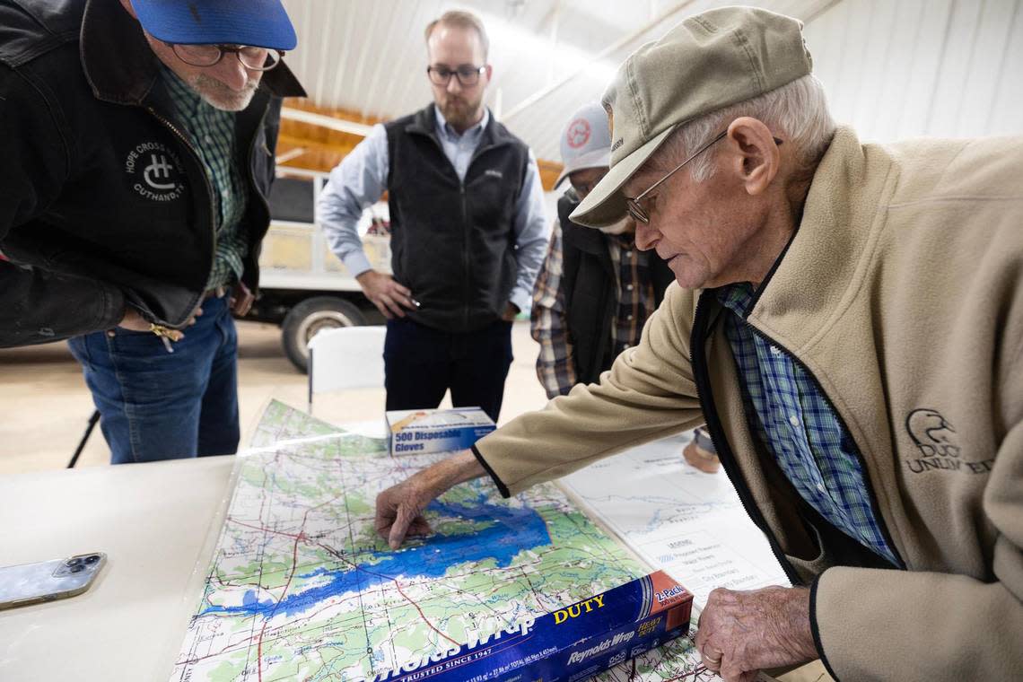 Cuthand residents look over maps that show the areas flooded in the proposed Marvin Nichols Reservoir Project. Locals living in Cuthand, TX – where the project would be located – and surrounding towns have campaigned to get the project removed from the state water plan.