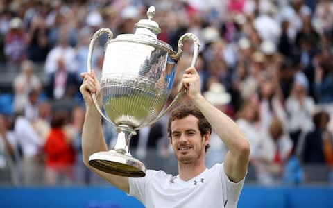 Great Britain's Andy Murray celebrates with the trophy after winning the final during day seven of the 2016 AEGON Championships at The Queen's Club, London. PRESS ASSOCIATION Photo. Picture date: Sunday June 19, 2016. See PA story TENNIS Queens - Credit: PA