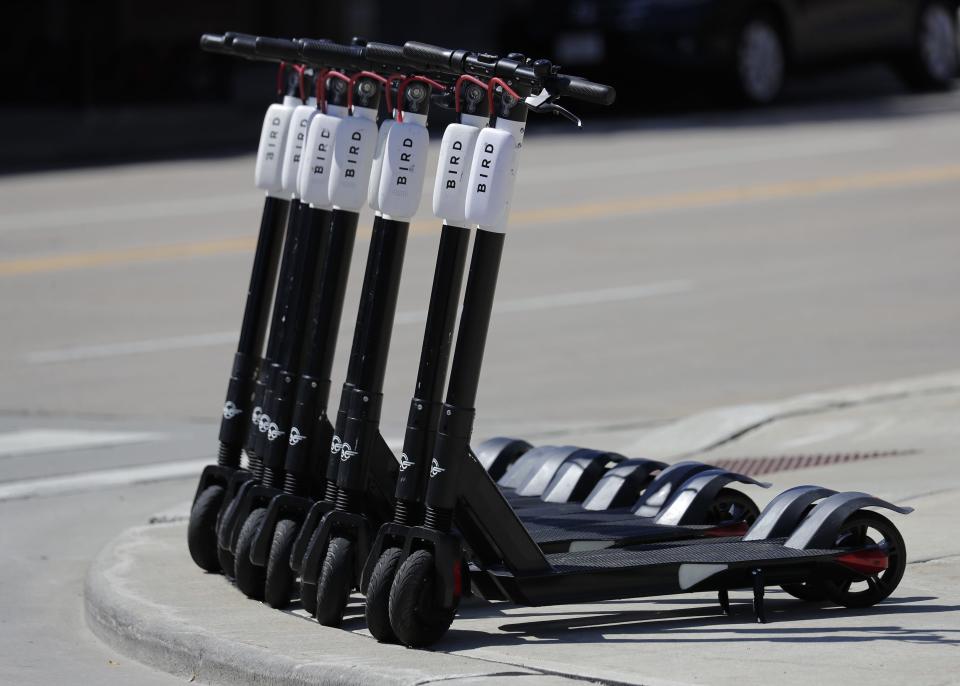 Bird scooters line College Avenue in Appleton.