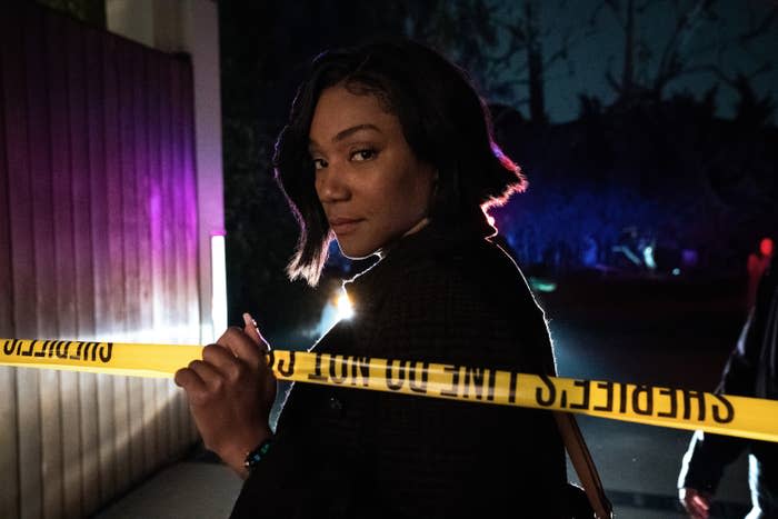 Tiffany Haddish holds crime scene tape