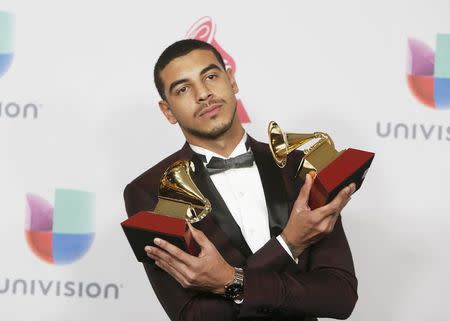 Manuel Medrano poses with his awards for Best New Artist and Best Singer-Songwriter Album for "Manuel Medrano" during the 17th Annual Latin Grammy Awards in Las Vegas, Nevada, U.S., November 17, 2016. REUTERS/Steve Marcus