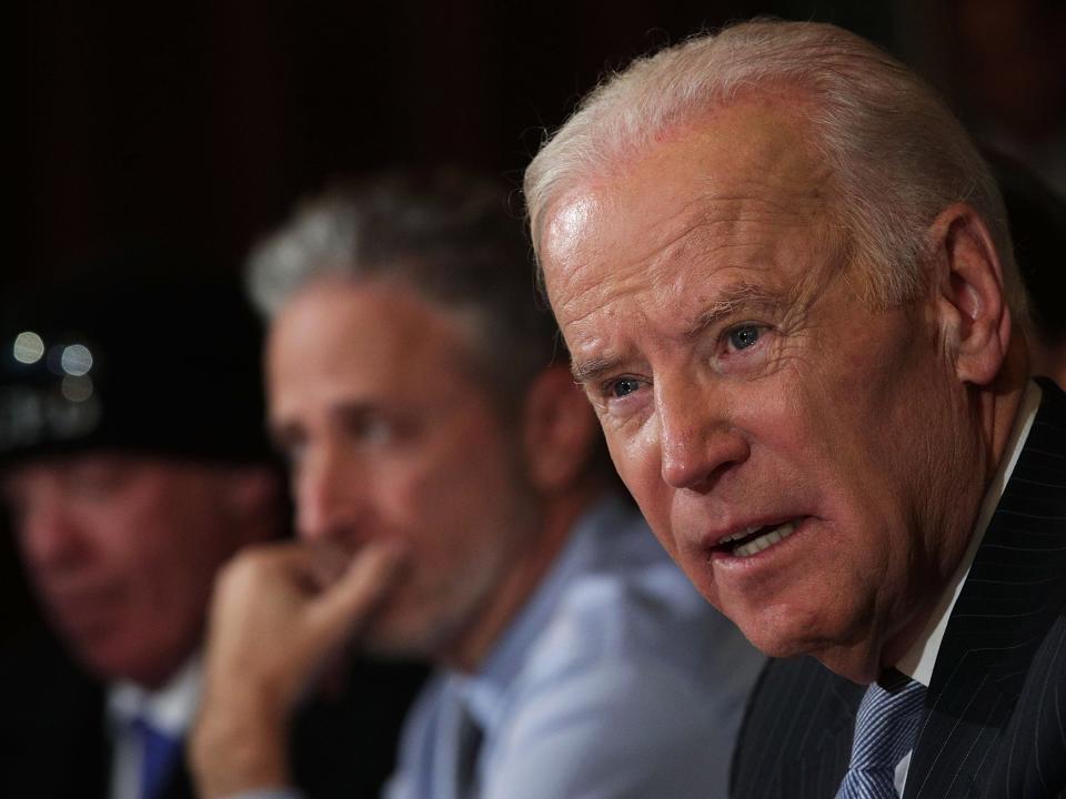 Then-U.S. Vice President Joe Biden speaks during a roundtable on the Cancer Moonshot Initiative as comedian Jon Stewart (2nd R) looks on December 13, 2016 at Eisenhower Executive Office Building in Washington, DC. Biden held a roundtable to discuss military and first responder care.