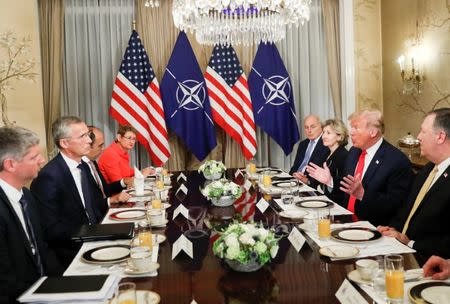 U.S. President Donald Trump and NATO Secretary General Jens Stoltenberg attend a bilateral breakfast ahead of the NATO Summit in Brussels, Belgium July 11, 2018. REUTERS/Kevin Lamarque