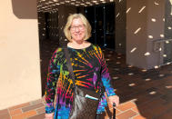 In this Tuesday, Jan. 28, 2020 photo, retired middle school teacher Debbie Sheehan discusses the 25th District congressional race outside the library in Simi Valley, Calif. The March 3 primary has more than a dozen candidates on the ballot. Mail-in ballots begin going out Monday. (AP Photo/Michael Blood)