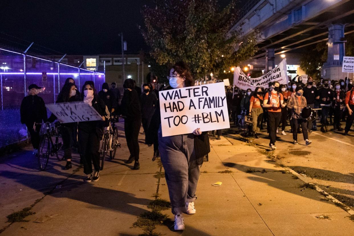 Protesters march through West Philadelphia to protest the fatal shooting of Walter Wallace Jr: AFP via Getty Images