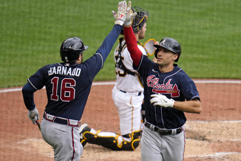 Atlanta Braves' Matt Olson, right, celebrates with Travis d'Arnaud (16) after hitting a solo home run off Pittsburgh Pirates starting pitcher Bailey Falter during the third inning of a baseball game in Pittsburgh, Thursday, Aug. 10, 2023. (AP Photo/Gene J. Puskar)