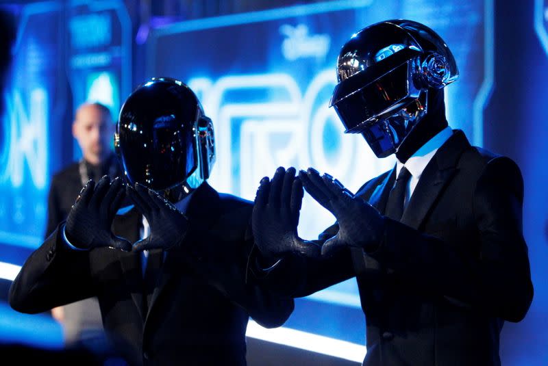 FILE PHOTO: Musicians Banglater and de Homem-Christo of Daft Punk pose at the world premiere of the film "TRON: Legacy" in Hollywood, California