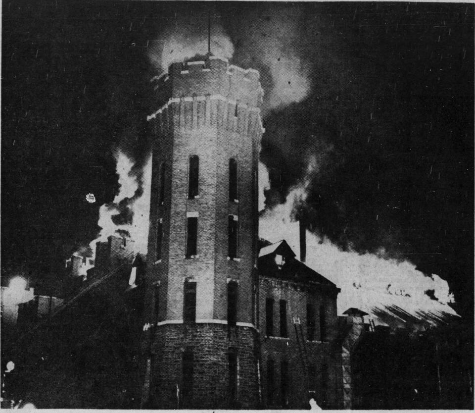 Flames lap around the tower of the former Binghamton armory in September 1951.