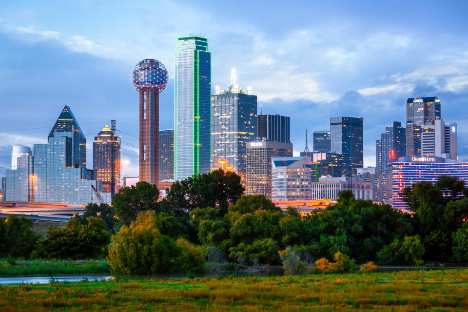 Dallas skyline at dusk with illuminated buildings