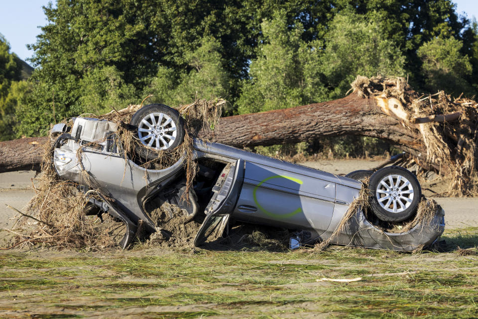 A car lies upside down in a paddock following Cyclone Gabrielle, in the Hawkes Bay, New Zealand, Saturday, Feb. 18, 2023. Cyclone Gabrielle struck the country's north on Feb. 13 and the level of damage has been compared to Cyclone Bola in 1988. That storm was the most destructive on record to hit the nation of 5 million people. (Mike Scott/NZ Herald via AP)