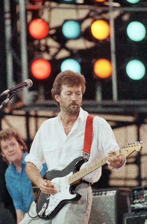 FILE - In this July 13, 1985 file photo, Eric Clapton performs at the Live Aid concert in Philadelphia. The Fender Stratocaster, used by countless professional and amateur musicians, celebrates its 60th anniversary in 2014. (AP Photo/George Widman)
