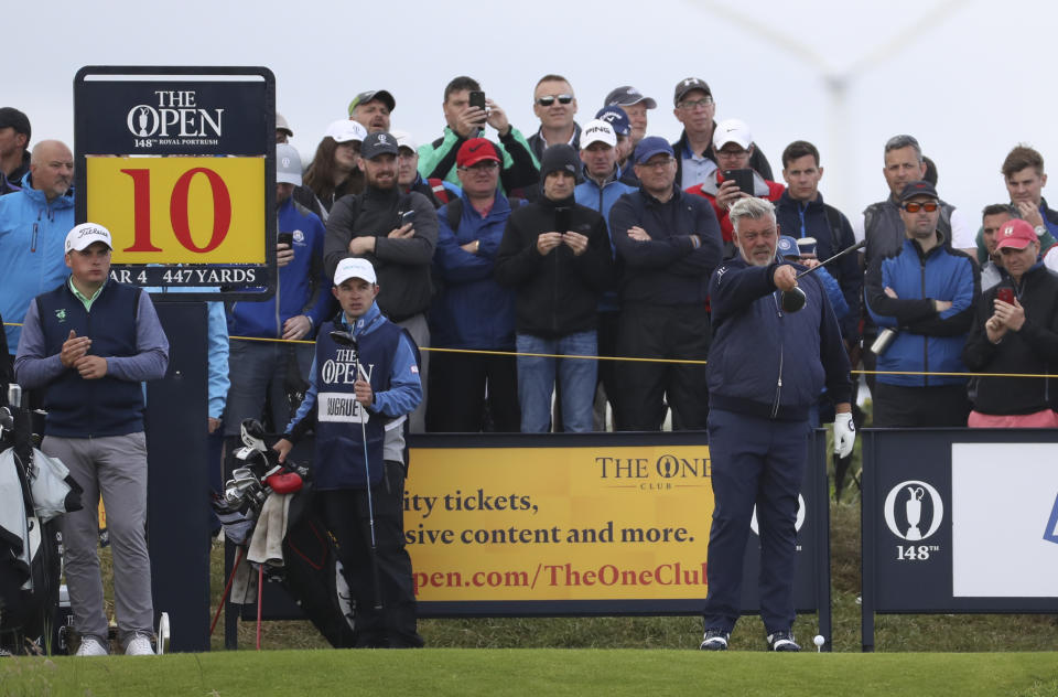 Northern Ireland's Darren Clarke points with this club as he stand on the 10th tee during the first round of the British Open Golf Championships at Royal Portrush in Northern Ireland, Thursday, July 18, 2019.(AP Photo/Peter Morrison)