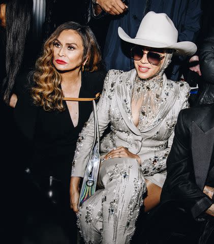<p>Nina Westervelt/WWD via Getty </p> Tina Knowles and Beyoncé attend the Luar fashion show on Feb. 13 during New York Fashion Week