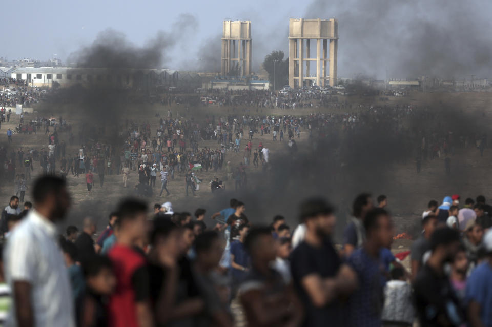 Palestinians protest at the Gaza Strip's border with Israel, Friday, Oct. 19, 2018. (AP Photo/Khalil Hamra)