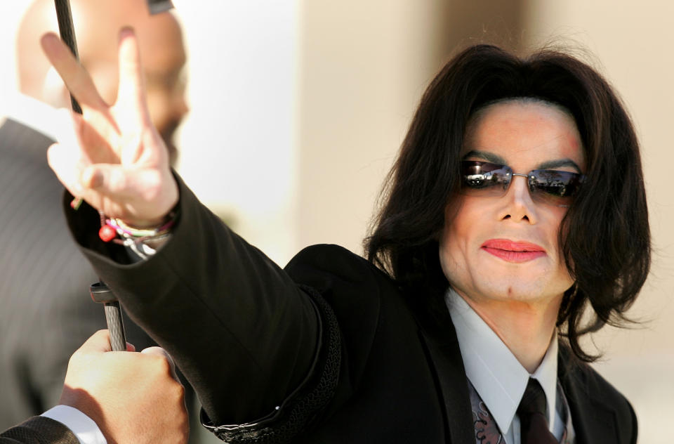 Michael Jackson walks into the Santa Maria Superior Court on the fifth day of his child molestation trial on March 7, 2005 in Santa Maria, Calif. - Credit: Carlo Allegri/Getty Images