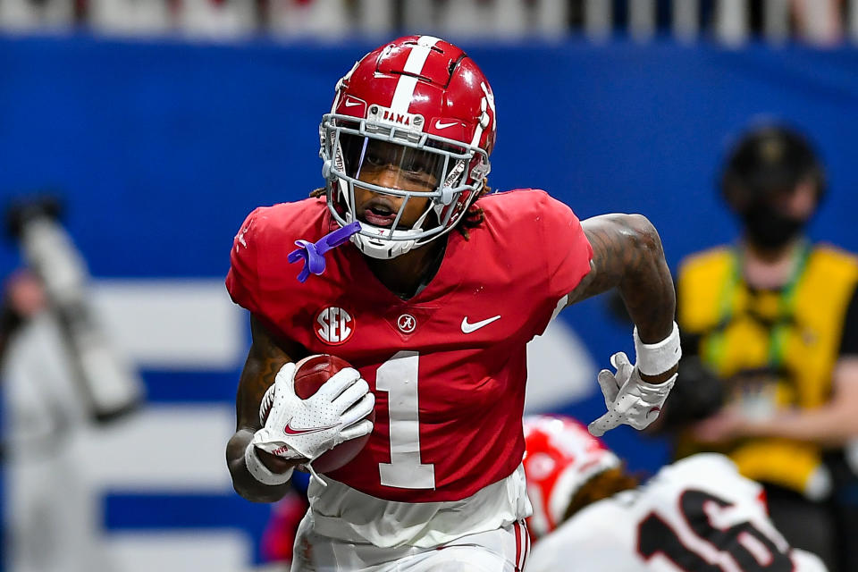 ATLANTA, GA  DECEMBER 04:  Alabama wide receiver Jameson Williams (1) reacts after catching a touchdown pass during the SEC Championship college football game between the Alabama Crimson Tide and Georgia Bulldogs on December 4th, 2021 at Mercedes Benz Stadium in Atlanta, GA.  (Photo by Rich von Biberstein/Icon Sportswire via Getty Images)