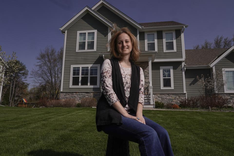 Jana Elkadri poses for a picture outside her Brookfield, Wis., home on April 23, 2021. (AP Photo/Morry Gash)
