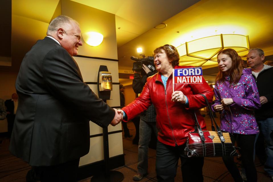 Toronto Mayor Rob Ford (L) greets supporters at his campaign launch party in Toronto, April 17, 2014. The Toronto municipal election is set for October 2014.