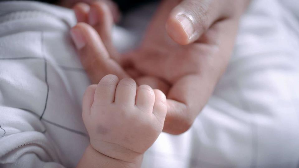 PHOTO: Stock photo of an infant holding their parent's hand. (STOCK PHOTO/Getty Images)