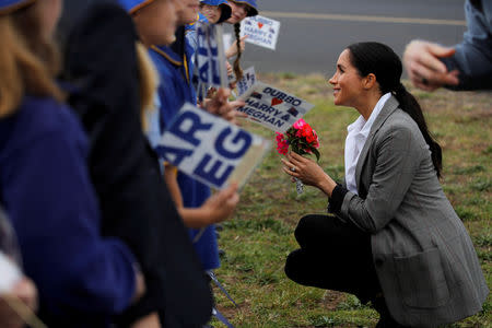 Meghan, Duchess of Sussex, interacts with children from Dubbo South Public School after arriving at Dubbo airport, Dubbo, Australia October 17, 2018. REUTERS/Phil Noble