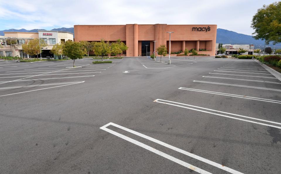 An empty parking lot in front of Macy's is seen at the Westfield Santa Anita shopping mall in Arcadia, Caifornia on March 18, 2020 as major retail stores close nationawide due to the coronavirus epidemic gripping fear across the United States. (Photo by Frederic J. BROWN / AFP) (Photo by FREDERIC J. BROWN/AFP via Getty Images)