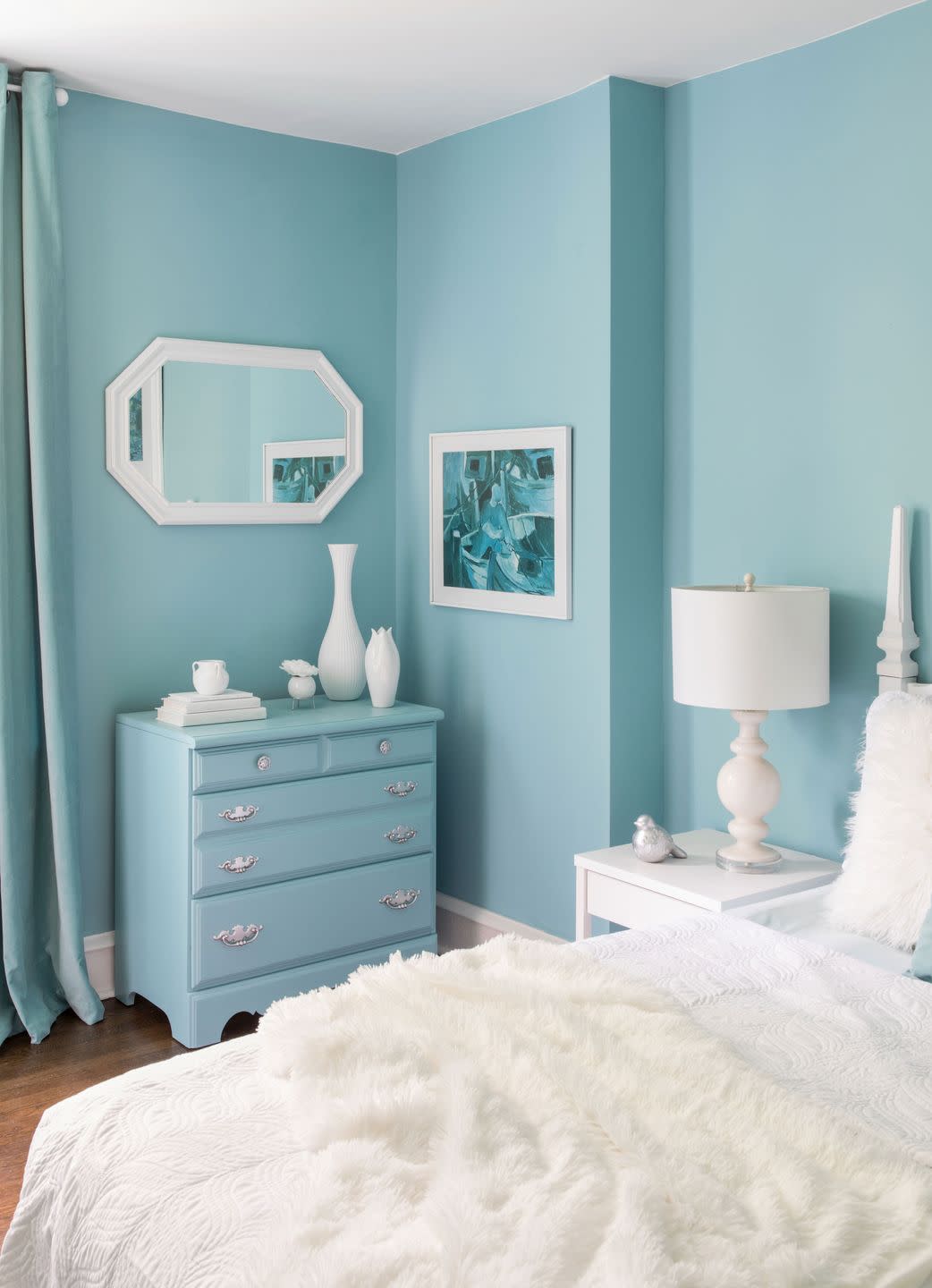 a bedroom with blue walls