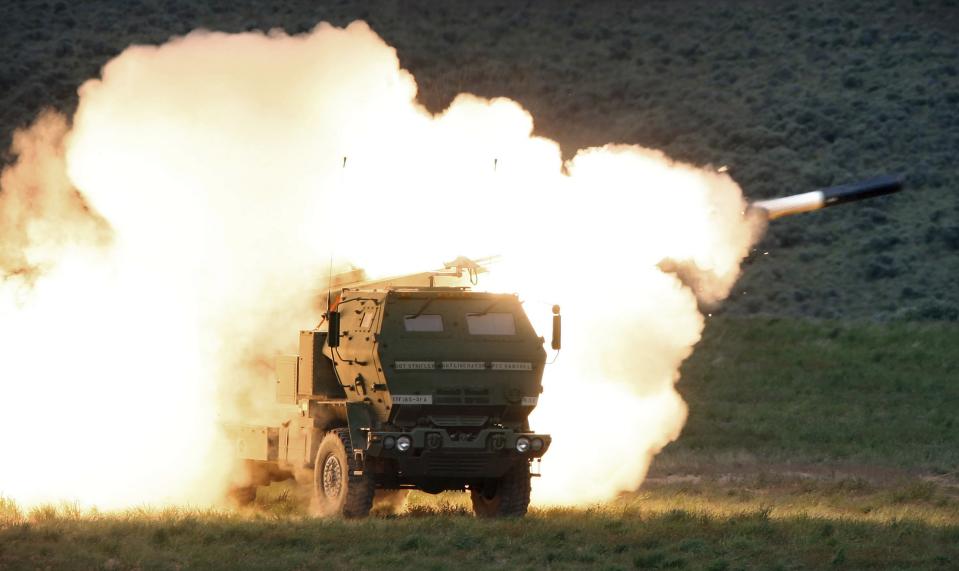 FILE - A launch truck fires the High Mobility Artillery Rocket System (HIMARS) produced by Lockheed Martin during combat training in the high desert of the Yakima Training Center, Washington on May 23, 2011. Ukraine has received about a dozen American-built HIMARS multiple rocket launchers and has used them to strike Russian ammunition depots, which are essential for maintaining Moscow's edge in firepower. (Tony Overman/The Olympian via AP, File)