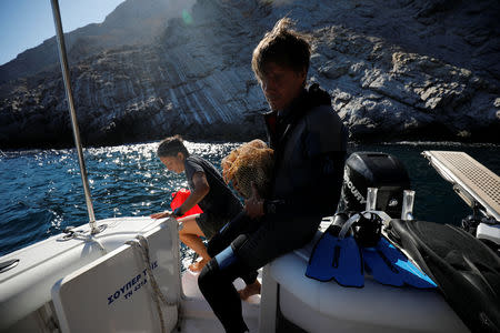 Archaeologist of the Hellenic Ephorate of Underwater Antiquities and Fournoi Survey Project director Dr. George Koutsouflakis, 50, holds an amphora retrieved from a shipwreck site on the island of Fournoi, Greece, September 19, 2018. Picture taken September 19, 2018. REUTERS/Alkis Konstantinidis