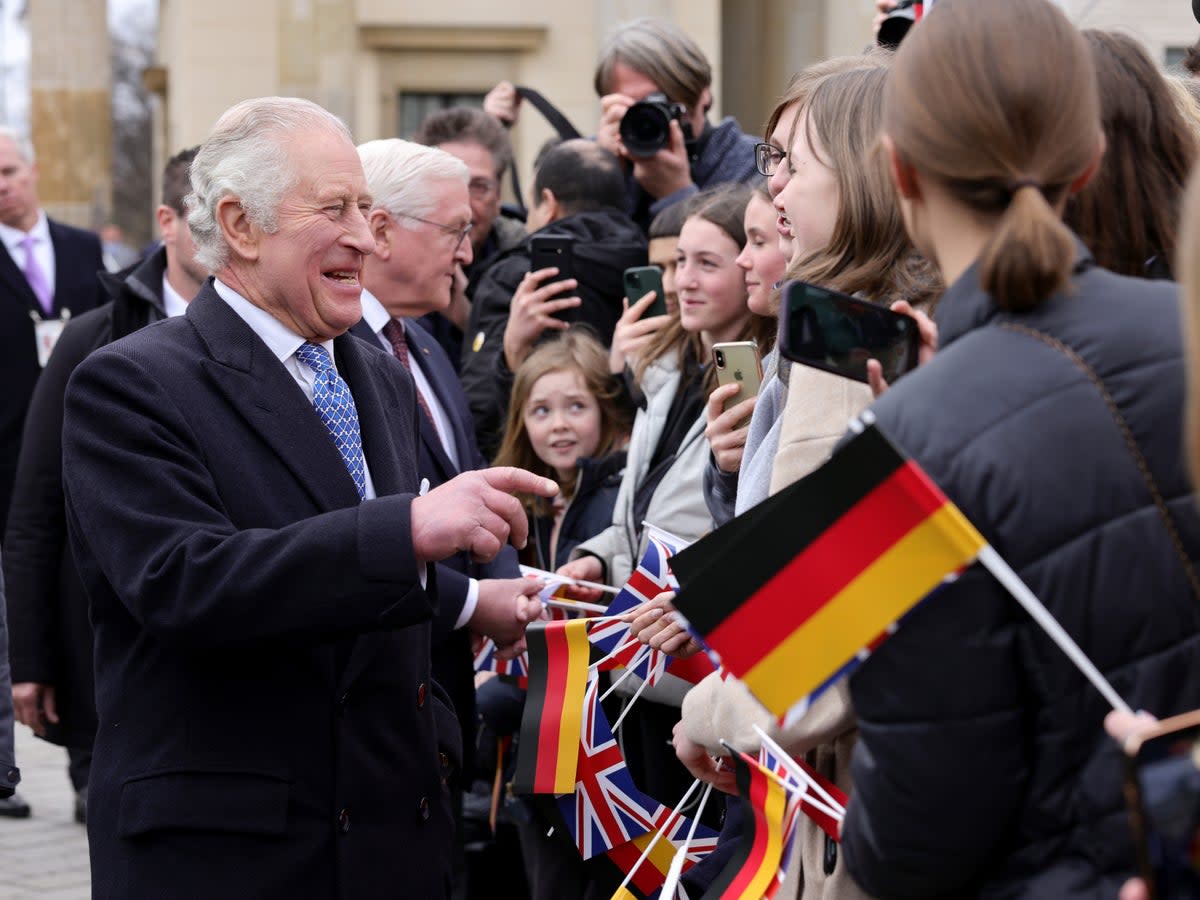 Charles III greets the crowd during the Ceremonial welcome at Brandenburg Gate (Getty Images)