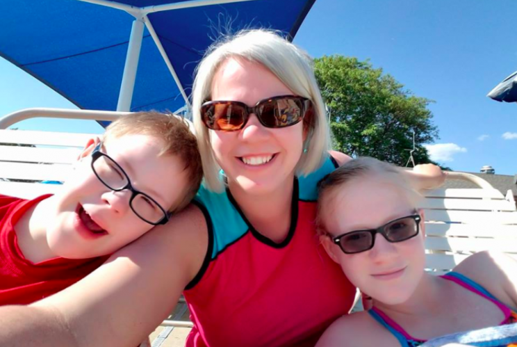 Kristen Miller Rumphol (center) with her kids, including Brandon (left), at the pool