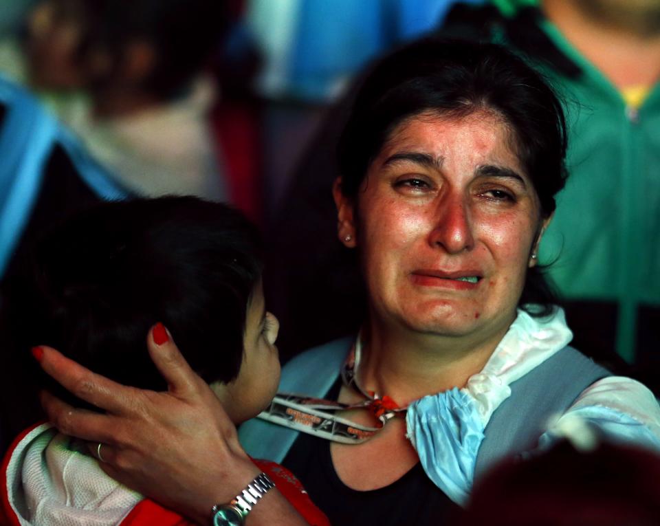 An Argentina fan reacts after Argentina lost to Germany in their 2014 World Cup final soccer match in Brazil, at a public square viewing area in Buenos Aires, July 13, 2014. REUTERS/Ivan Alvarado (ARGENTINA - Tags: SPORT SOCCER WORLD CUP)