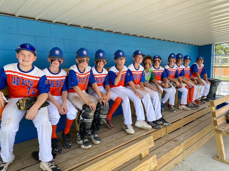 Players from the Marlborough 10U team in the dugout in Vincennes, Indiana. Marlborough is competing in the Cal Ripken 10U World Series this week.