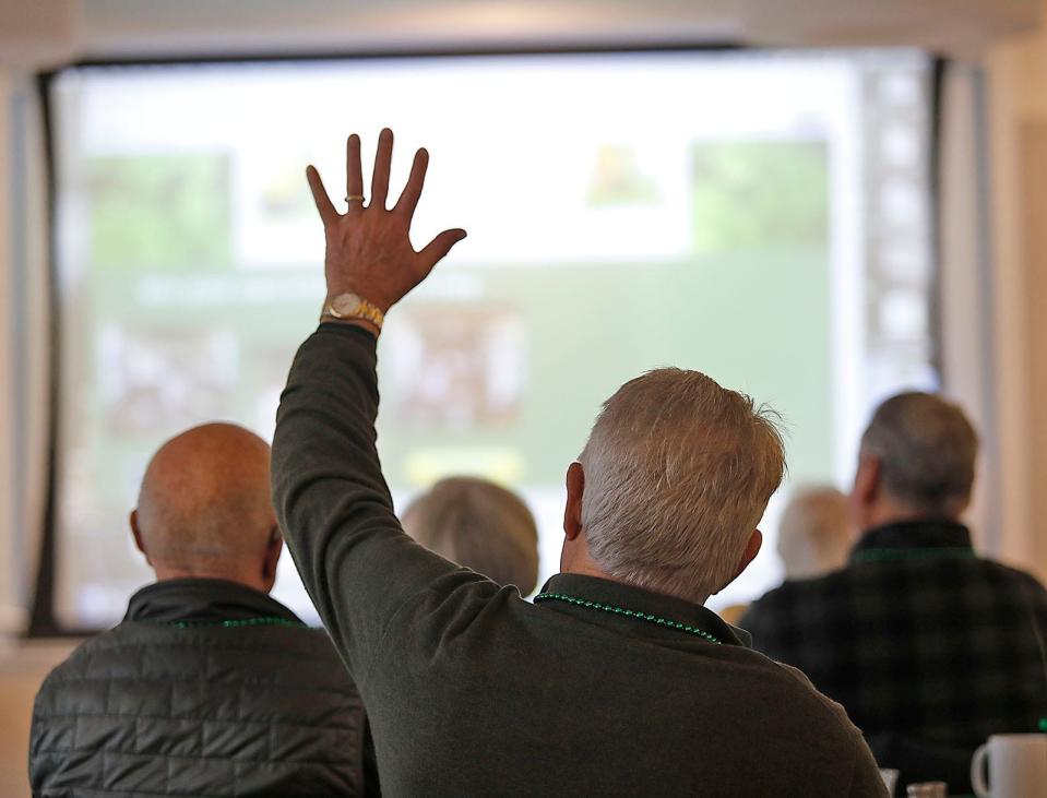 A man asks a question of Ed Kelley, chairman of the Scituate St. Patrick's Day Parade, during an event at the Scituate Senior on Tuesday, March 5, 2024. This year's edition of the parade will take place on Sunday, March 17.