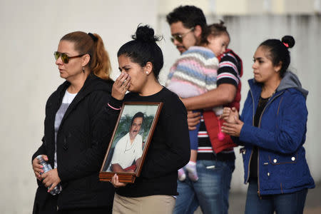 Relatives of slain journalist Ricardo Monlui arrive for his funeral mass at a church in Cordoba, in the Mexican state of Veracruz, Mexico March 20, 2017. REUTERS/Yahir Ceballos