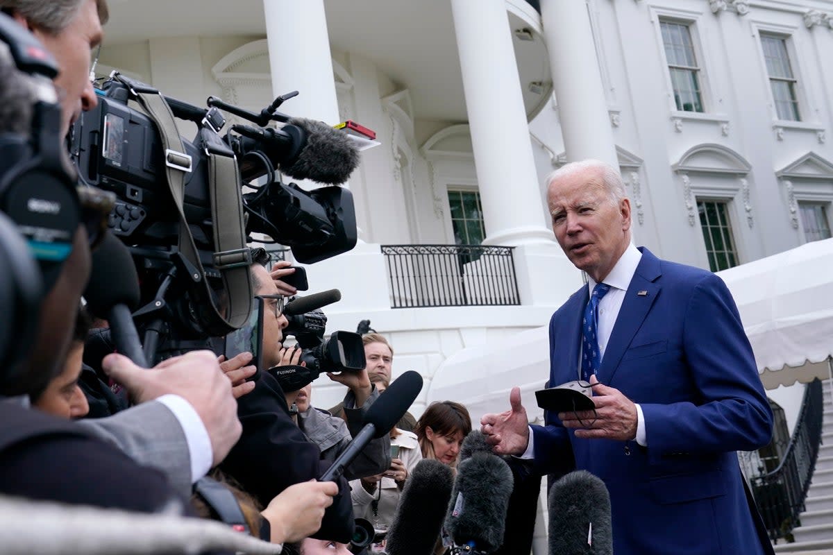 President Joe Biden talks with reporters outside of the White House in Washington, Wednesday, Jan. 4, 2023, before boarding Marine One on the South Lawn. Biden is heading to Kentucky to visit a notoriously dilapidated bridge connecting Ohio and Kentucky to promote his administration's infrastructure law. (AP Photo/Susan Walsh) (AP)