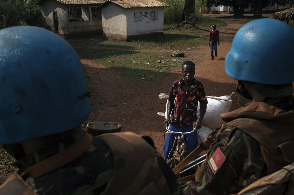 Moroccan UN peacekeepers patrol the town of Bangassou, Central African Republic, Monday Feb. 15, 2021. An estimated 240,000 people have been displaced in the country since mid-December, according to U.N. relief workers, when rebels calling themselves the Coalition of Patriots for Change launched attacks, causing a humanitarian crisis in the already unstable nation. (AP Photo/Adrienne Surprenant)