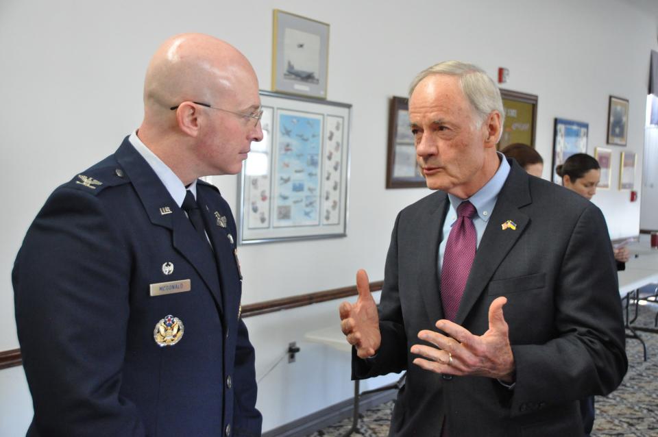 From left, Col. Chris McDonald, 436th Airlift Wing commander, talks with Sen. Tom Carper at the State of the Base program Monday at Dover Air Force Base.
