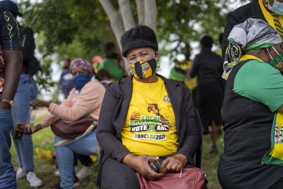 An African National Congress party (ANC) supporter who could not access the party's 110th birthday celebration at Polokwane's Peter Mokaba stadium, sits outside the entrance, in Polokwane, South Africa, Saturday Jan. 8, 2022. Because of coronavirus regulations, only 2000 could attend the anniversary , amid deep divisions, graft allegations and broad challenges that saw the ANC perform dismally in local government elections last year. ( (AP Photo/Jerome Delay)