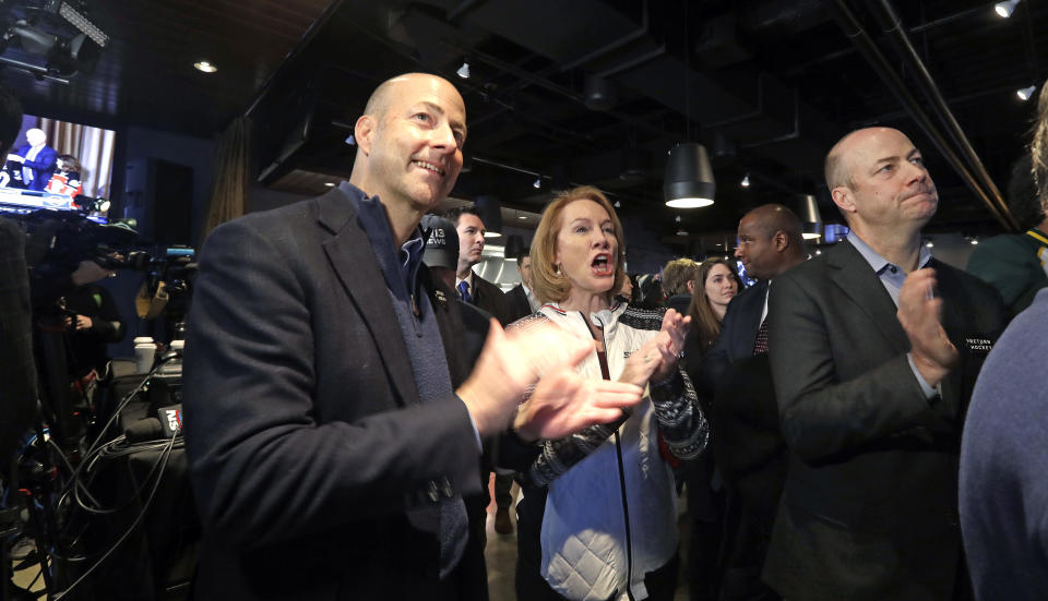 Seattle Mayor Jenny Durkan, center, cheers the announcement of a new NHL hockey team in Seattle with brothers Ted Ackerley, left, and Chris Ackerley at a celebratory party Tuesday, Dec. 4, 2018, in Seattle. The NHL Board of Governors unanimously approved adding Seattle as the league's 32nd franchise on Tuesday, with play set to begin in 2021 to allow enough time for arena renovations. (AP Photo/Elaine Thompson)