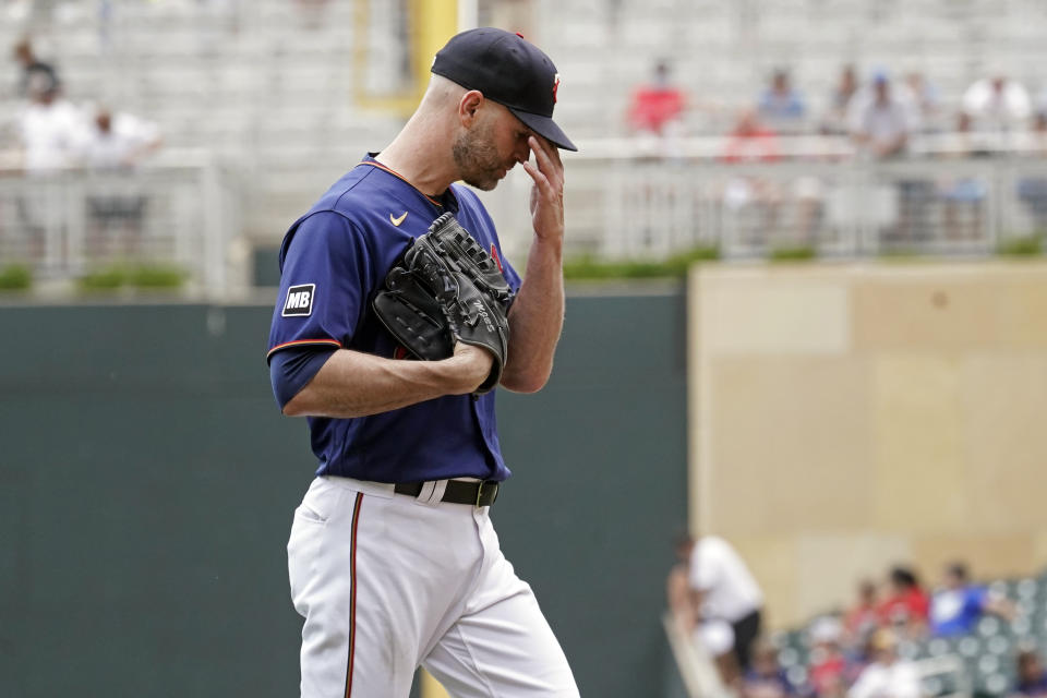 Minnesota Twins pitcher J.A. Happ heads to the dugout after he was pulled in the fourth inning of a baseball game against the Detroit Tigers, Wednesday, July 28, 2021, in Minneapolis. (AP Photo/Jim Mone)