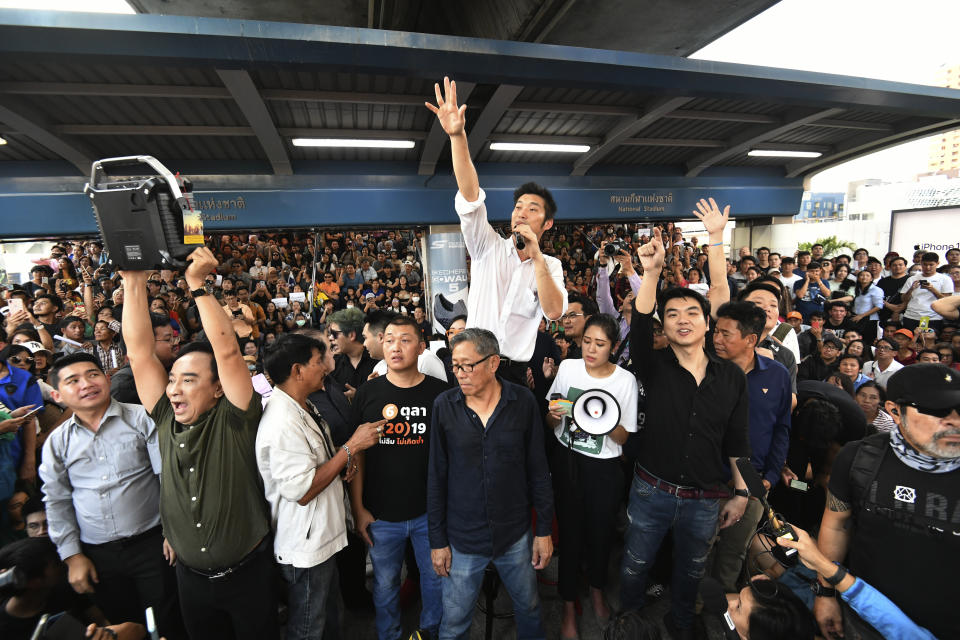 Thailand's Future Forward Party leader Thanathorn Juangroongruangkit talks to his supporters during rally in Bangkok, Thailand, Saturday, Dec. 14, 2019. Several thousand supporters of a popular Thai political party, under threat of dissolution, packed a concourse in central Bangkok on Saturday in one of the largest political demonstrations in recent years.(AP Photo/Str)