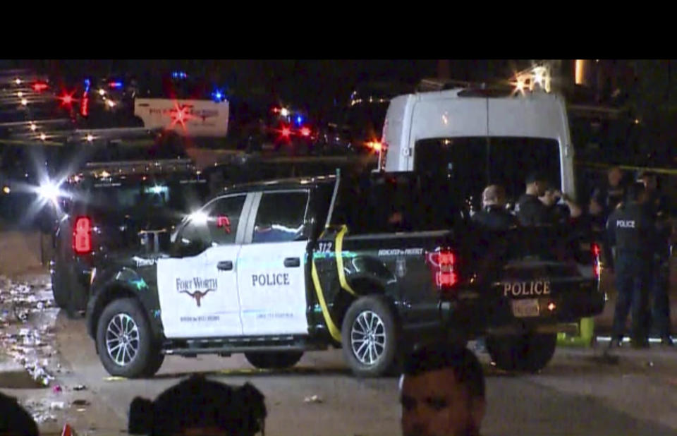Police arrive on the scene of a deadly shooting late Monday, July 3, 2023 in Forth Worth, Texas. Authorities say gunfire erupted following a local festival in the Como neighborhood in the city's southwest. (WFAA via AP)